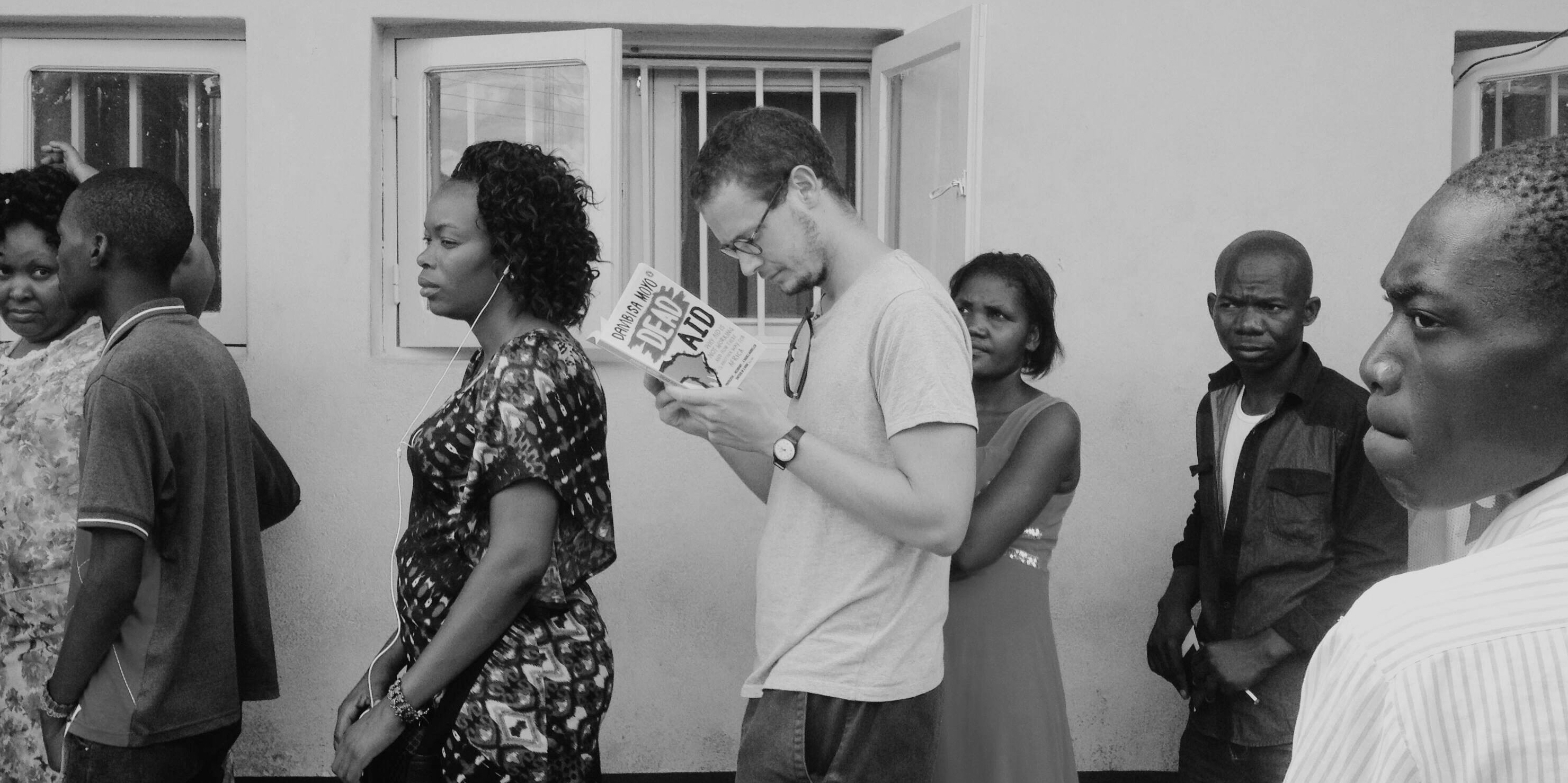 pic of me : alex in malawi border queue bw.png